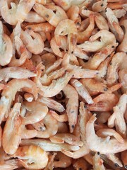 Lots of frozen shrimp in a supermarket showcase