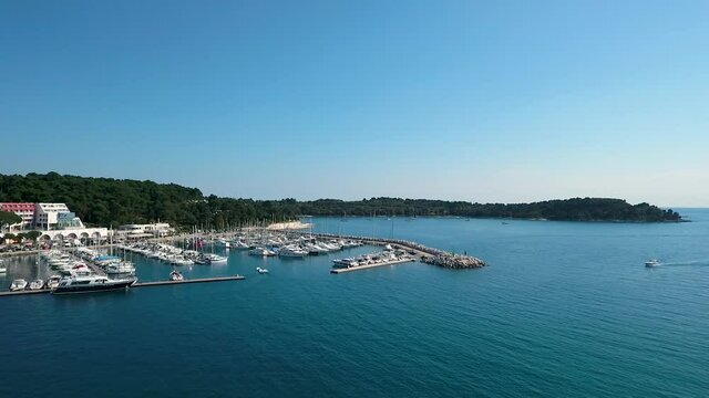 Aerial view of sailing boats anchored at a marina near Rovinj, Croatia.