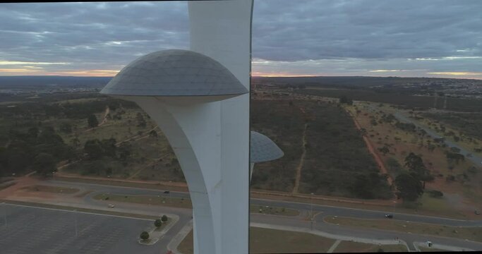 Close sunset aerial orbiting the observation galleries in the middle of of Brasilia Digital TV Tower (Torre de TV Digital de Brasilia)