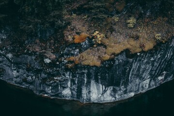 Steep cliffs among the azure lake