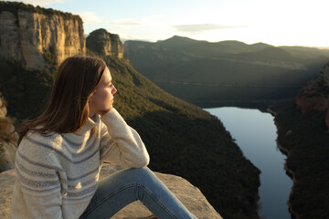 Fototapeta na wymiar Woman contemplating views in the mountain