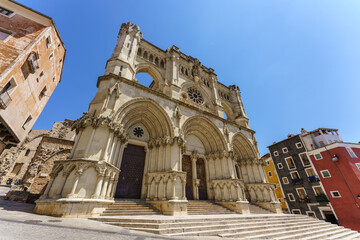 Fototapeta na wymiar Cuenca, Spain. June 27, 2020. Cuenca cathedral main facade, first gothic-style cathedral in the Iberian peninsula (together with Avila's one). It is located in the old town, UNESCO World Heritage. 