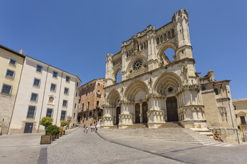 Fototapeta na wymiar Cuenca, Spain. June 27, 2020. Cuenca cathedral main facade, first gothic-style cathedral in the Iberian peninsula (together with Avila's one). It is located in the old town, UNESCO World Heritage. 