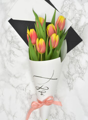 bouquet of tulips in a paper bag