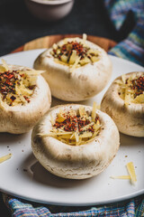 Button mushrooms stuffed with cheese and spices