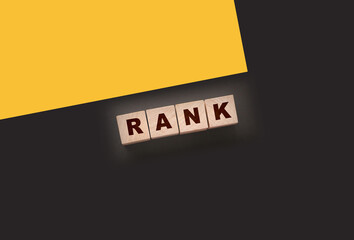 RANK text on a black background on wooden cubes. Ranking SEO concept