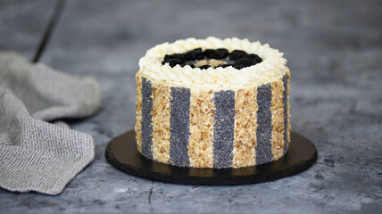 Delicious cake with prunes, nuts and poppy seeds.