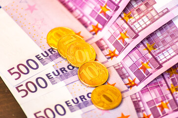 Russian ruble coins on 500 euro banknotes