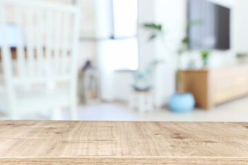 Wooden empty table in front of Living room interior. For product display and presentation