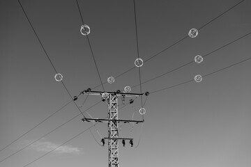 Power lines against clear sky. Electricity equipment with copy space. 