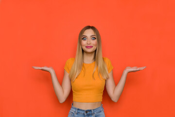 Happy And Excited Young Woman Is Holding Hands Raised And Comparing Something