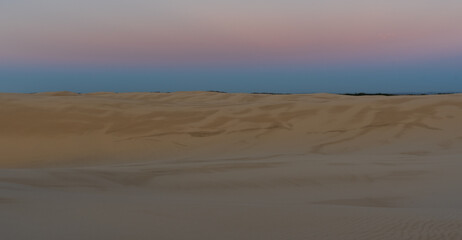 Fototapeta na wymiar sand dunes at sunrise on Stockton beach