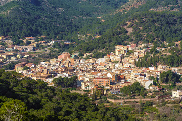 Fototapeta na wymiar Idyllic town in a green mountain landscape. Serra, Comunidad Valenciana, Spain