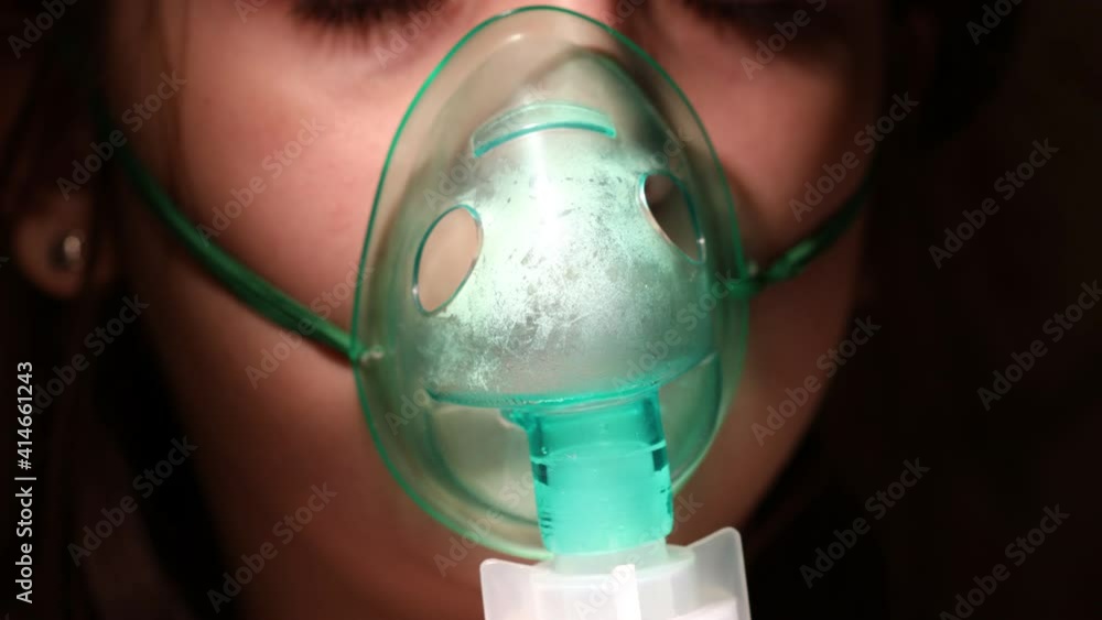 Canvas Prints inhalation mask on a child's face close-up. High quality 4k footage