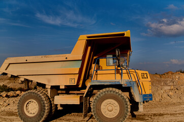 Obraz premium truck bulldozer sand construction work outdoors blue sky summer