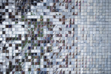 Silver square sequins. High resolution pattern. View from above. Copy space.