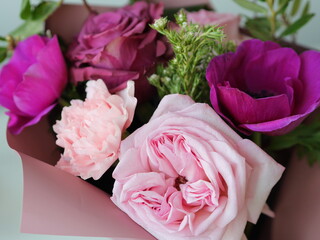 pink and violet rose anemon carnation bouquet close up