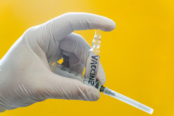 Ampoule with vaccine and medical disposable syringe