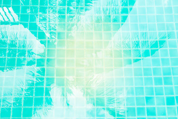 Fototapeta na wymiar Abstract water texture background, coconut tree shadow on swimming pool water, tropical and summer concept background, vintage tone style
