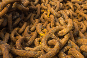 Large iron anchor chain. A rusty chain link. Corrosion. Shackles.