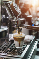 coffee extraction from professional coffee machine with bottomless filter
