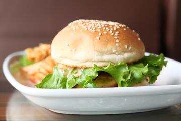 beef burger on a plate on table close up 