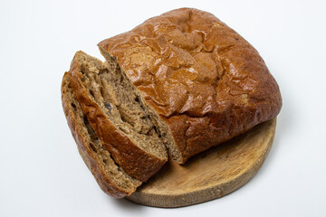 Sliced black bread on a white plate. Borodino bread. Homemade baking. Bakery product