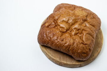 Black bread on a white background. Borodino bread. Homemade baking. Bakery product