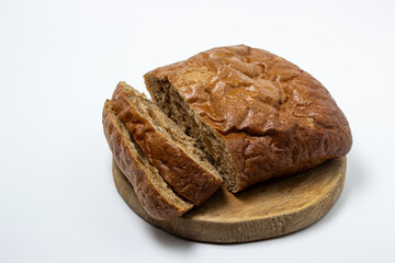 Sliced black bread on a white plate. Borodino bread. Homemade baking. Bakery product