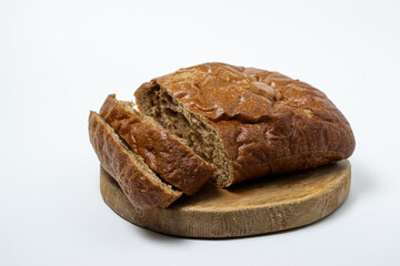 Sliced black bread on a white plate. Borodino bread. Homemade baking. Bakery product