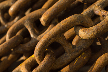 Large iron anchor chain. A rusty chain link. Corrosion. Shackles.