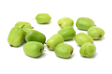 mini kiwi baby fruit (actinidia arguta) on white background 