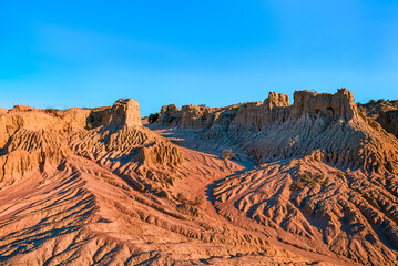 Clear day at Mungo national park in australia. No Clouds and classic eroded red rock formations