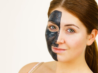 Woman with charcoal facial mask