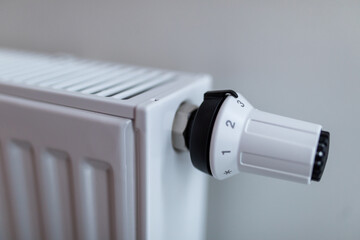 Heating white radiator radiator in living room. Heating.