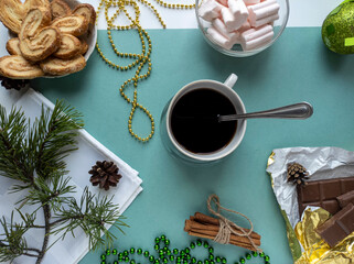 new year's flat lay. green background. top view photo. Christmas decorations, coffee. New year, Christmas, Valentine's day.