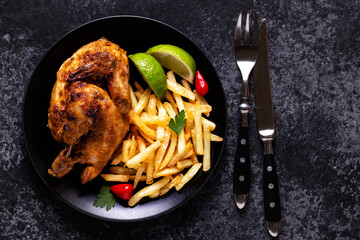 Half roasted chicken Piri Piri with french fries
