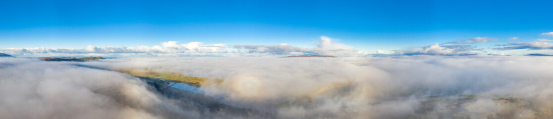 Above the clouds at Portnoo in County Donegal with fog - Ireland