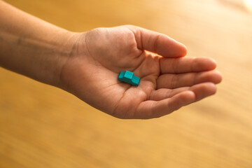 Hand protecting a car from accidents. Auto insurance concept