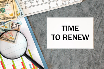 Time to renew is written in a document on the office desk, money, diagram and magnifier