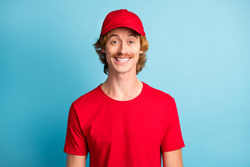 Portrait of satisfied working person toothy smile look camera isolated on pastel blue color background