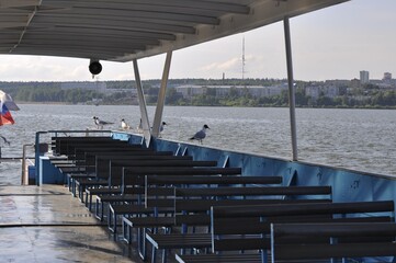 A small simple ship, interior, for excursions on the lake, walking tourists on the water. The...