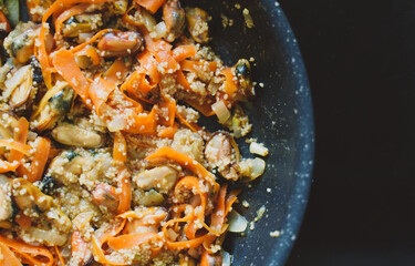 Cooking of traditional Moroccan couscous with mussels.