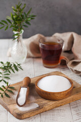 Natural sweetener in a wooden spoon. Sugar substitute. Erythritol