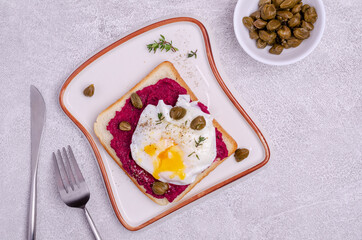 Sandwich with beetroot sauce and egg