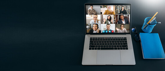Online business briefing, webinar. Panoramic photo of a laptop screen with webcam shots of multiracial diverse business people communication from home by a video conference. Brainstorm, virtual