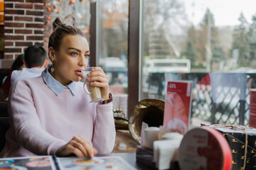 Girl drinking latte