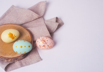 Easter painted eggs on a light background, a festive background for your decoration. Easter background, place for text
