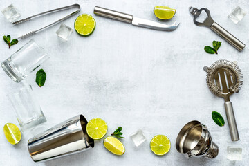 Frame of bar utensils and tools for Mojito cocktail - shaker, lime and ice