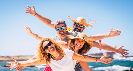 Group of happy adult friends enjoy and celebrate together the summer holiday vacation travel...